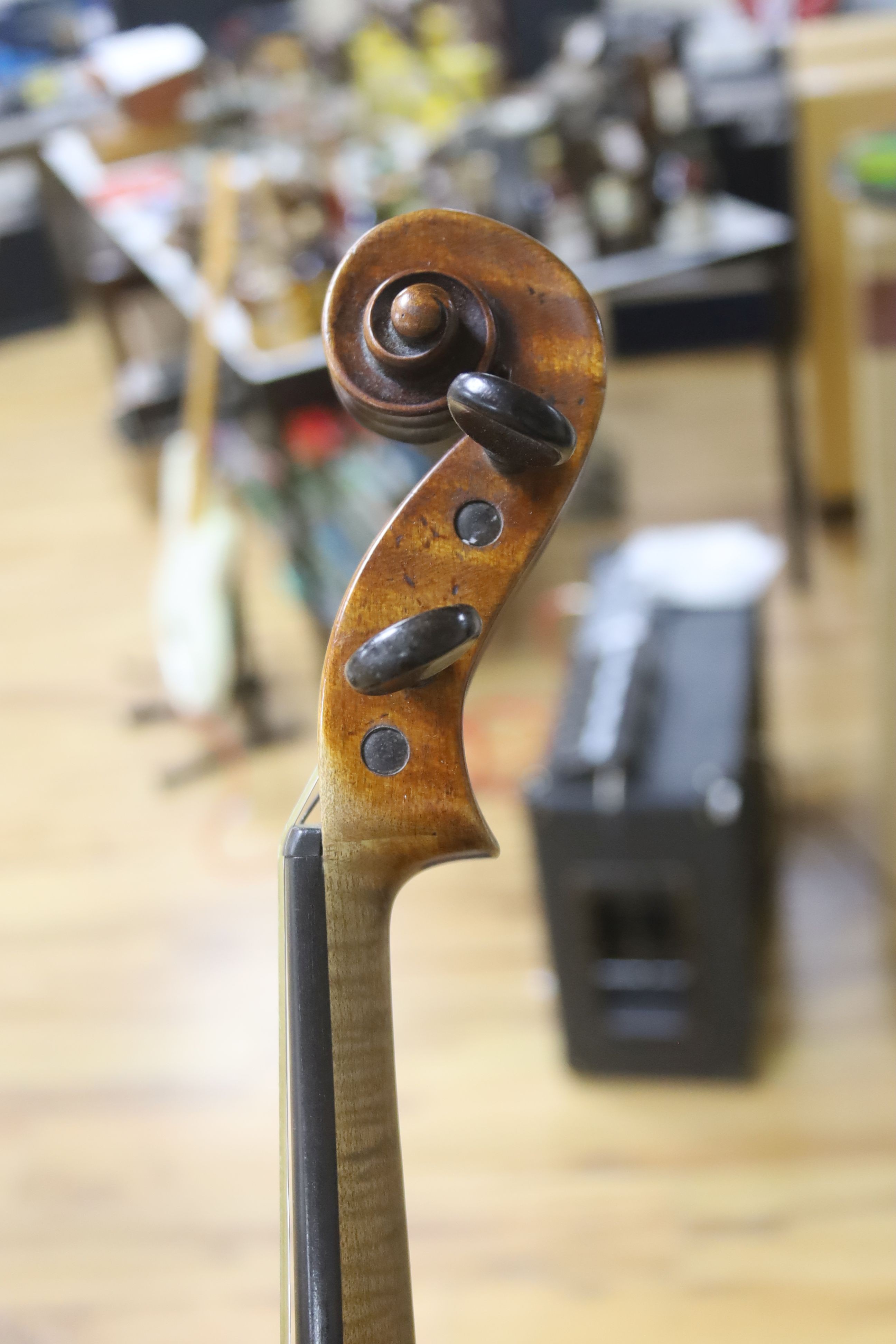 A cased violin and bow